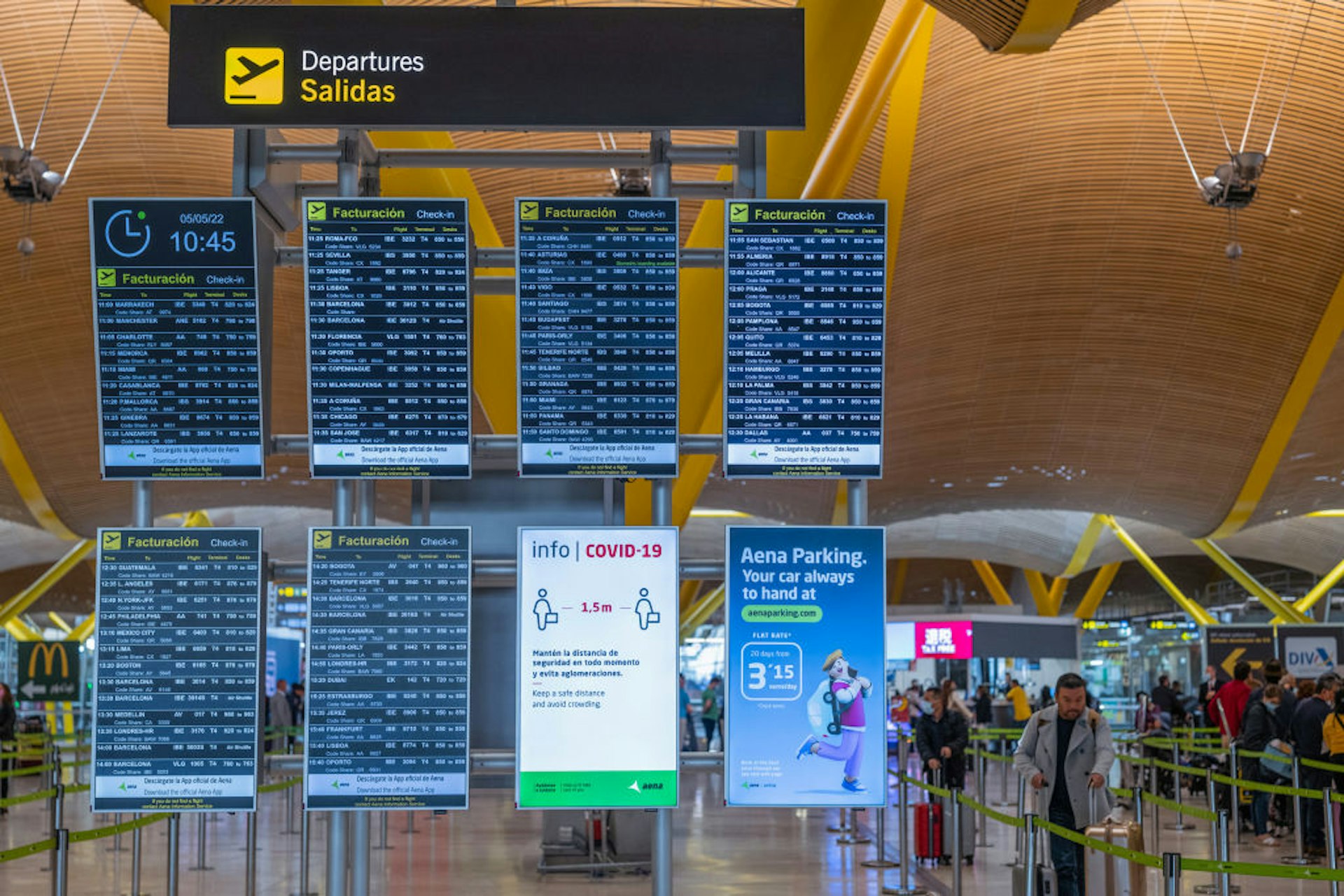 Electronic screens display flight information in the departures hall at Madrid Barajas airport