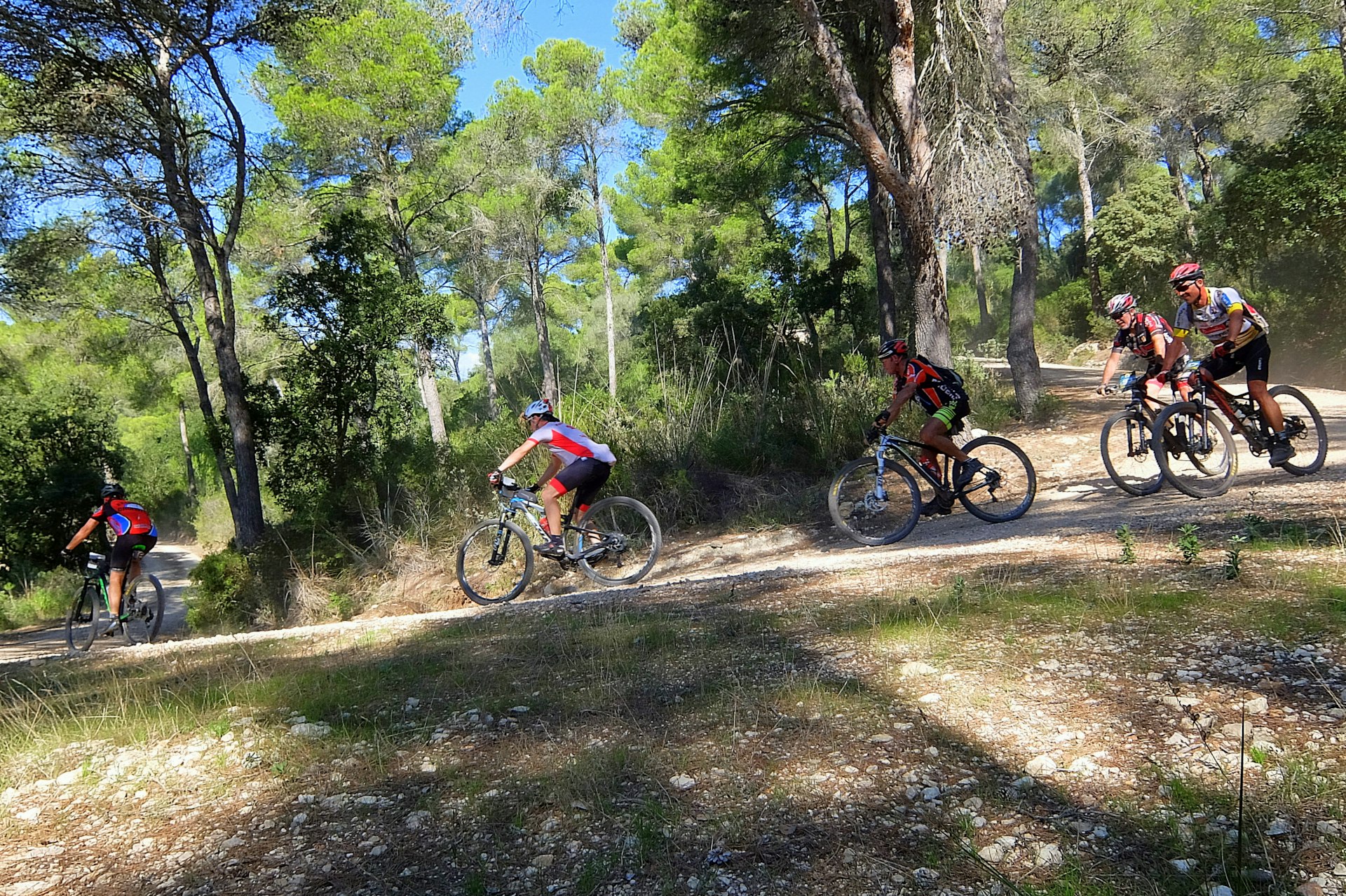 Mountain bikers ride along the Camí de Cavalls path in Menorca