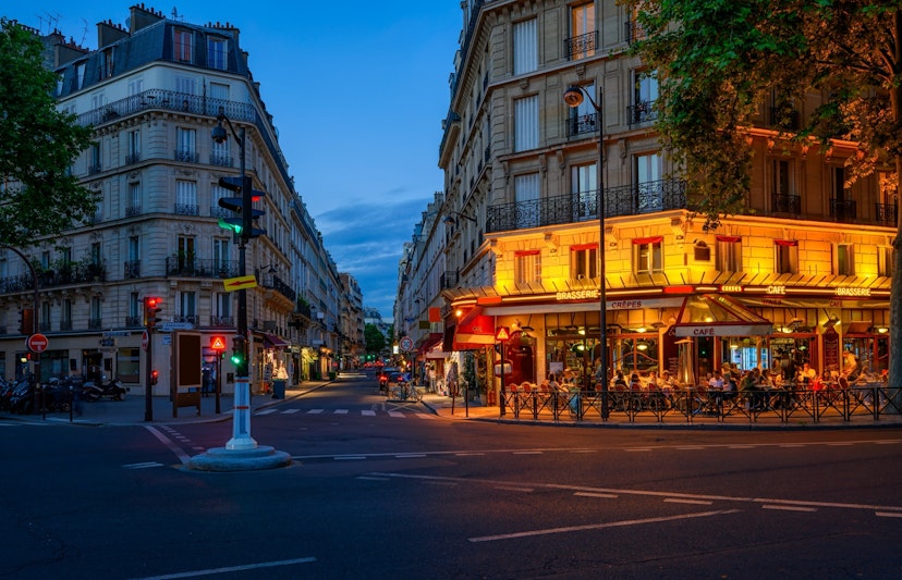 Cozy street with tables of cafe in Paris, France. Night cityscape of Paris. Architecture and landmarks of Paris.; Shutterstock ID 2043692471; your: Ben N Buckner; gl: 65050; netsuite: Online Editorial; full: Samsung Night Cities