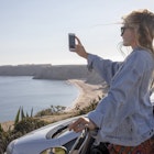 A driver pauses to take a photo of the coast on the Algarve