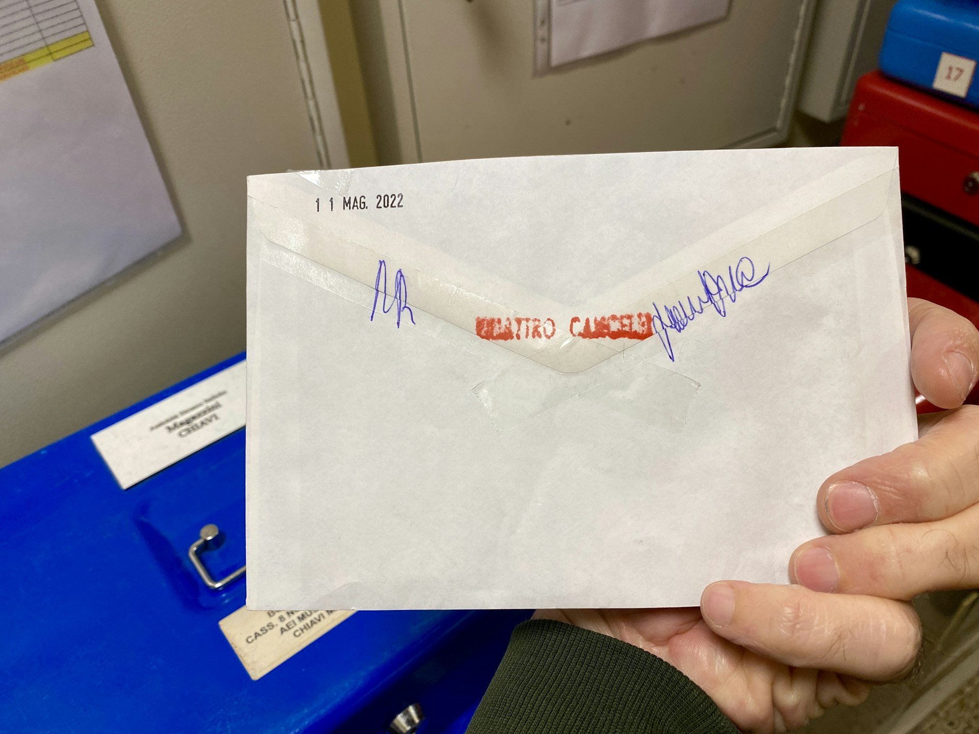 A key inside of a sealed envelope. 