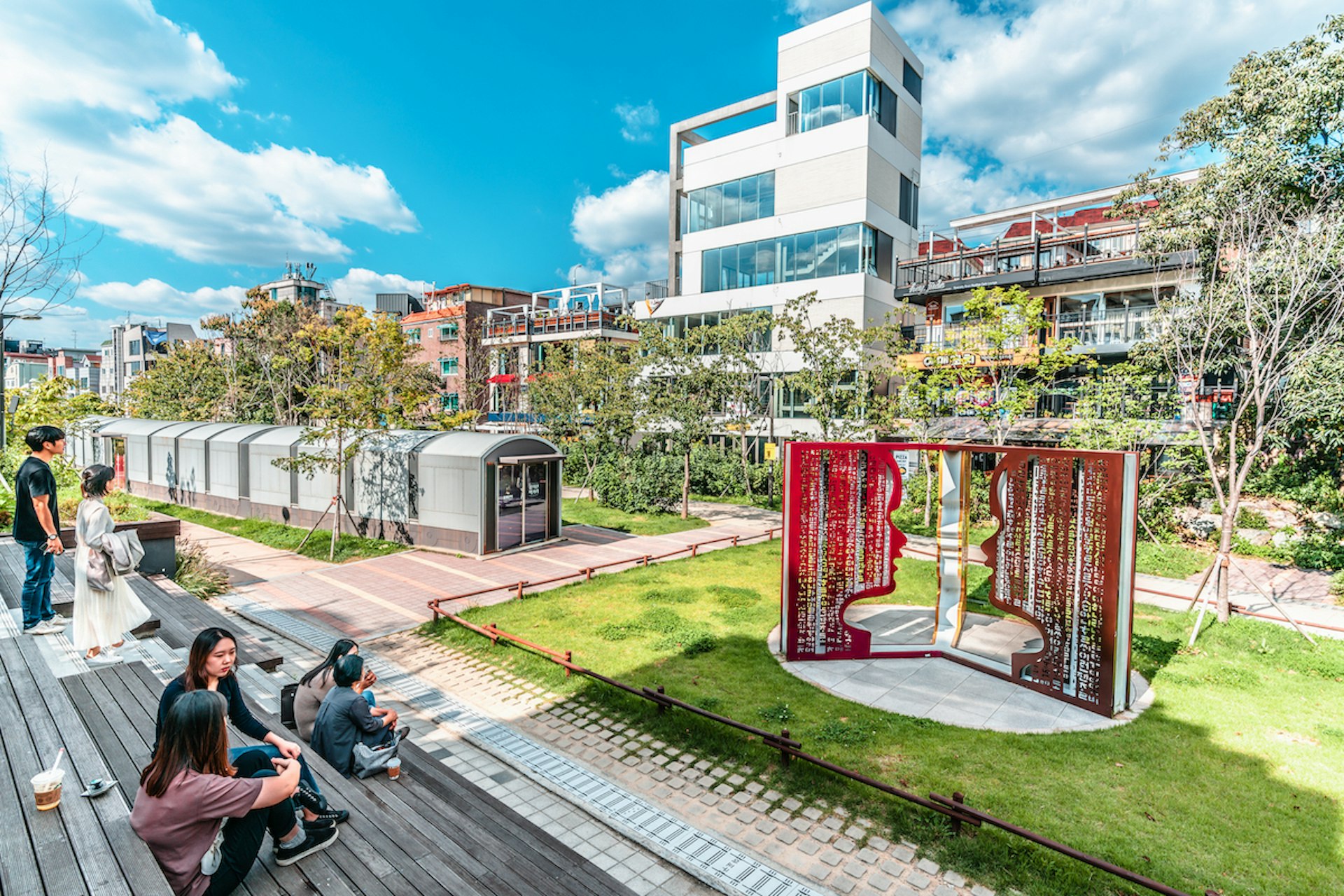 People relax in Gyeongui Line Forest Park on a sunny day, Yeonnam-dong, Seoul, South Korea