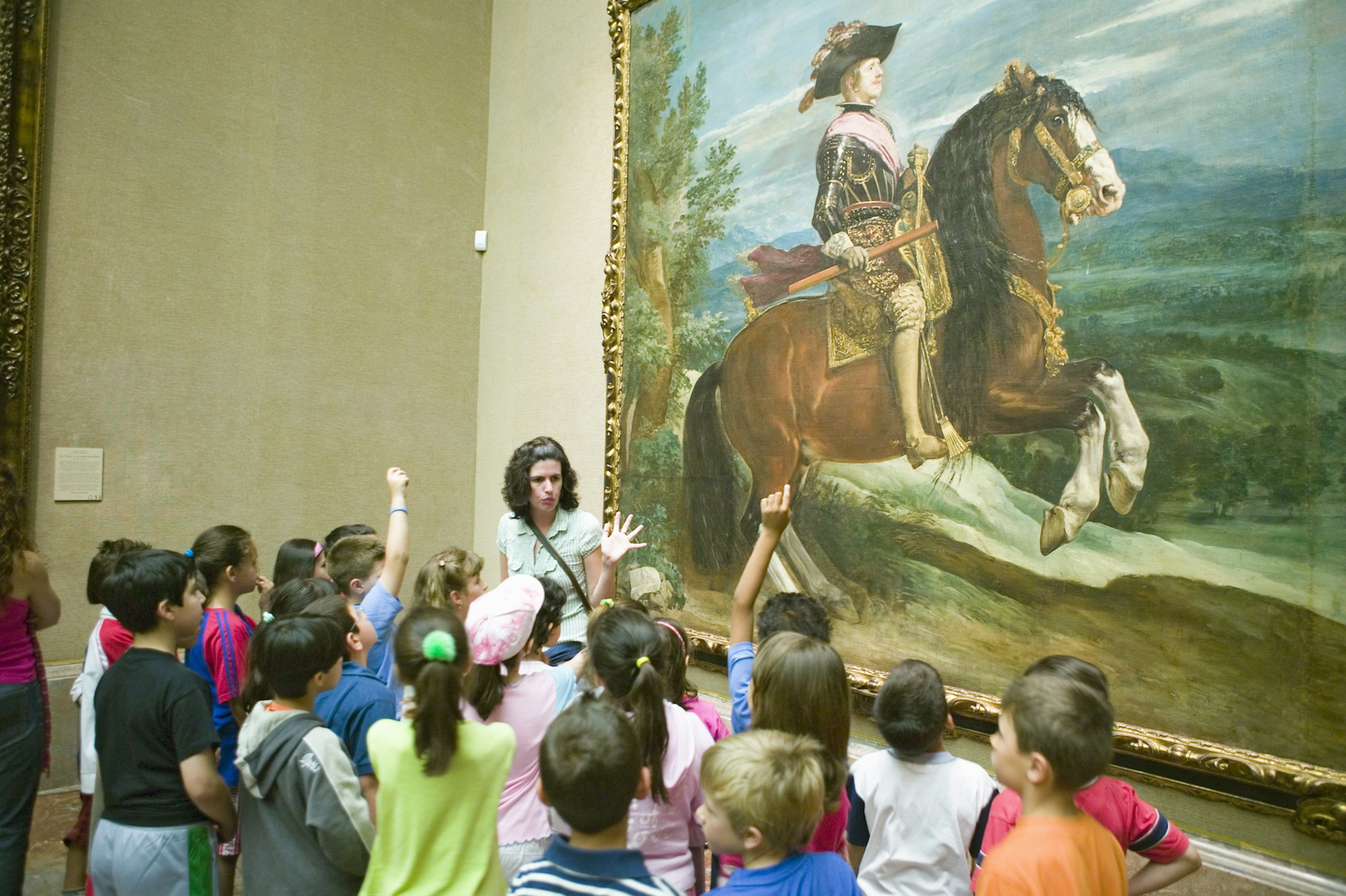 An educator interacts with children in from of