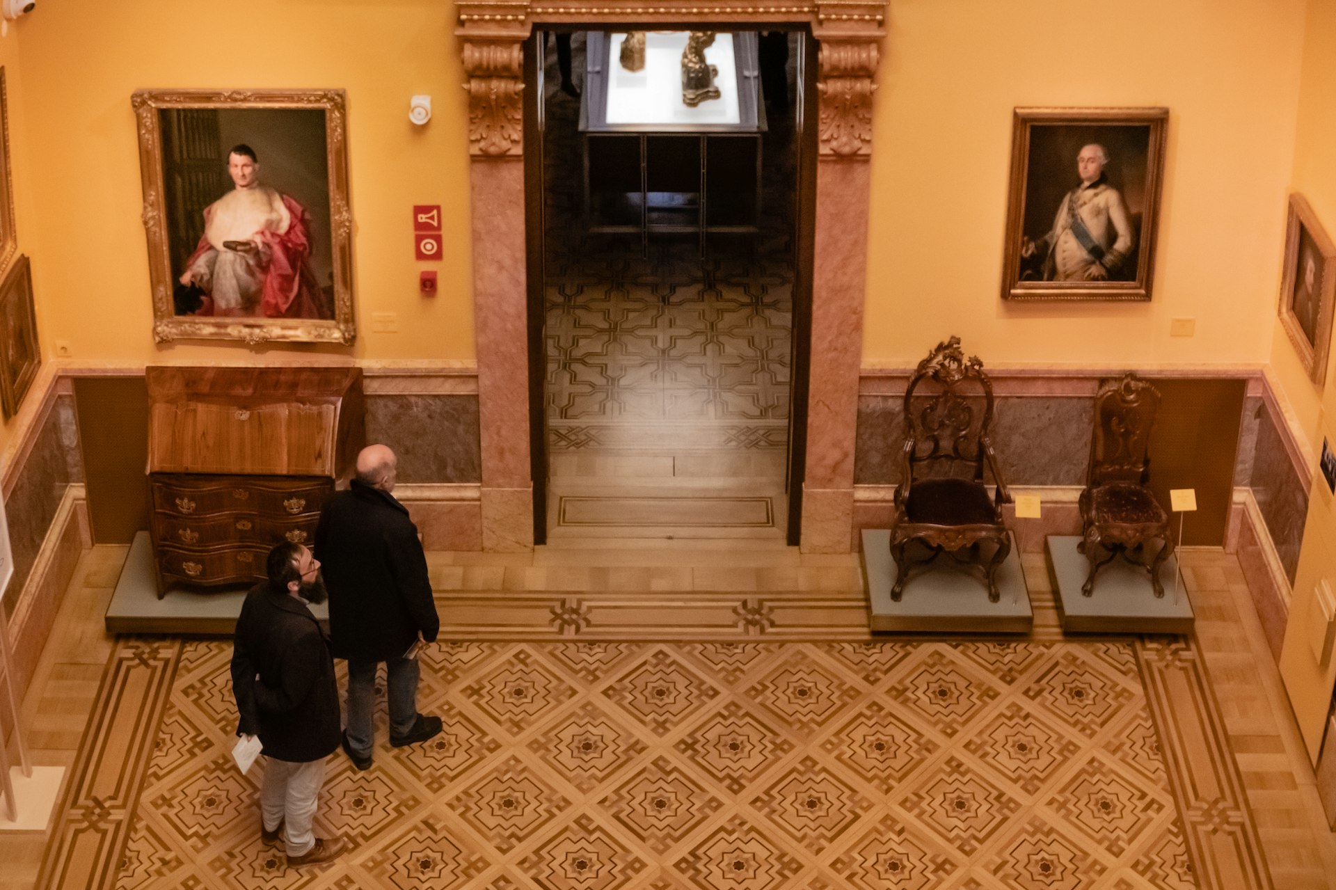 Seen from above, visitors admire paintings in the luxurious galleries of Museo Lázaro Galdiano, Madrid, Spain