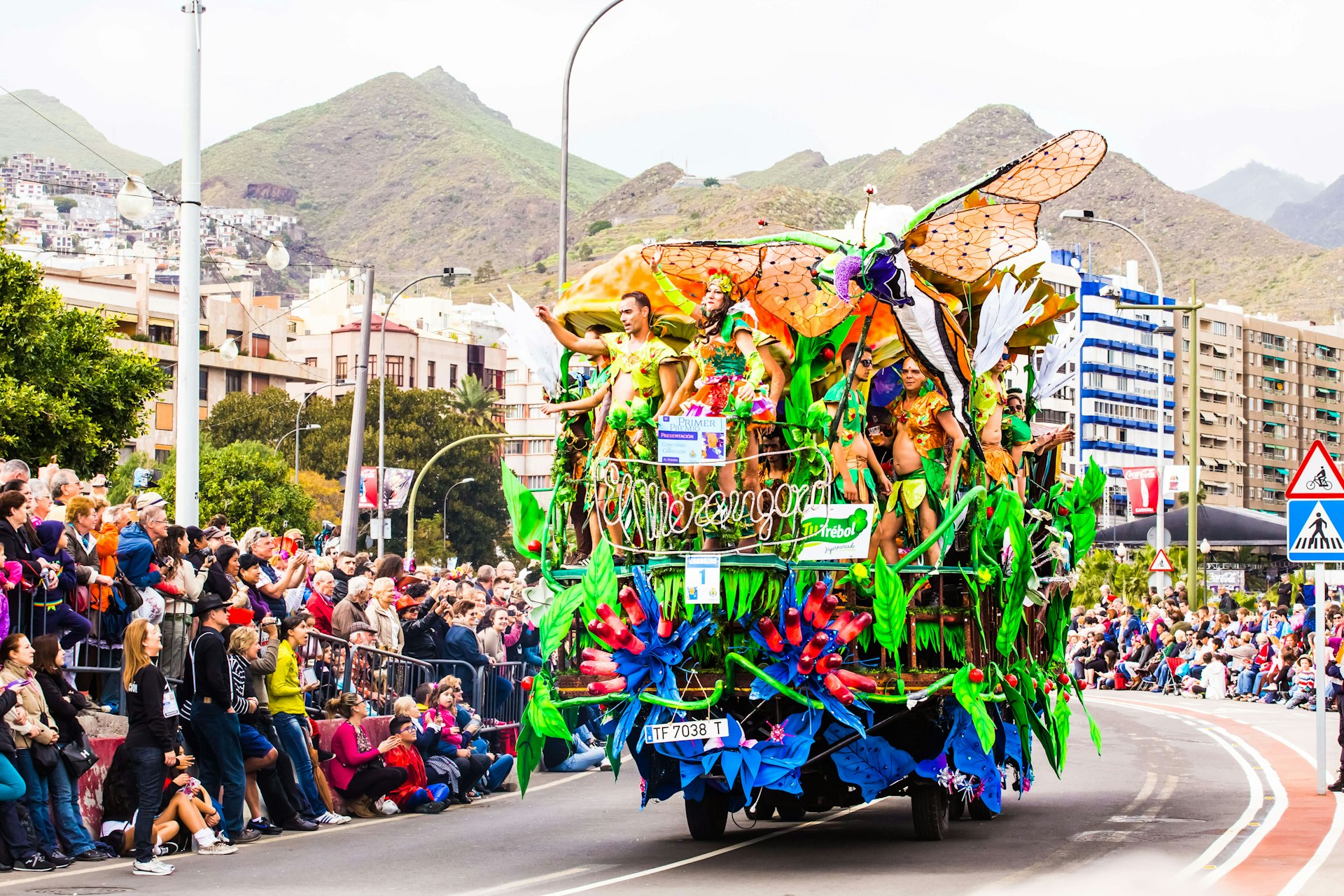 Carnival groups and costumed characters parade through the streets in Tenerife