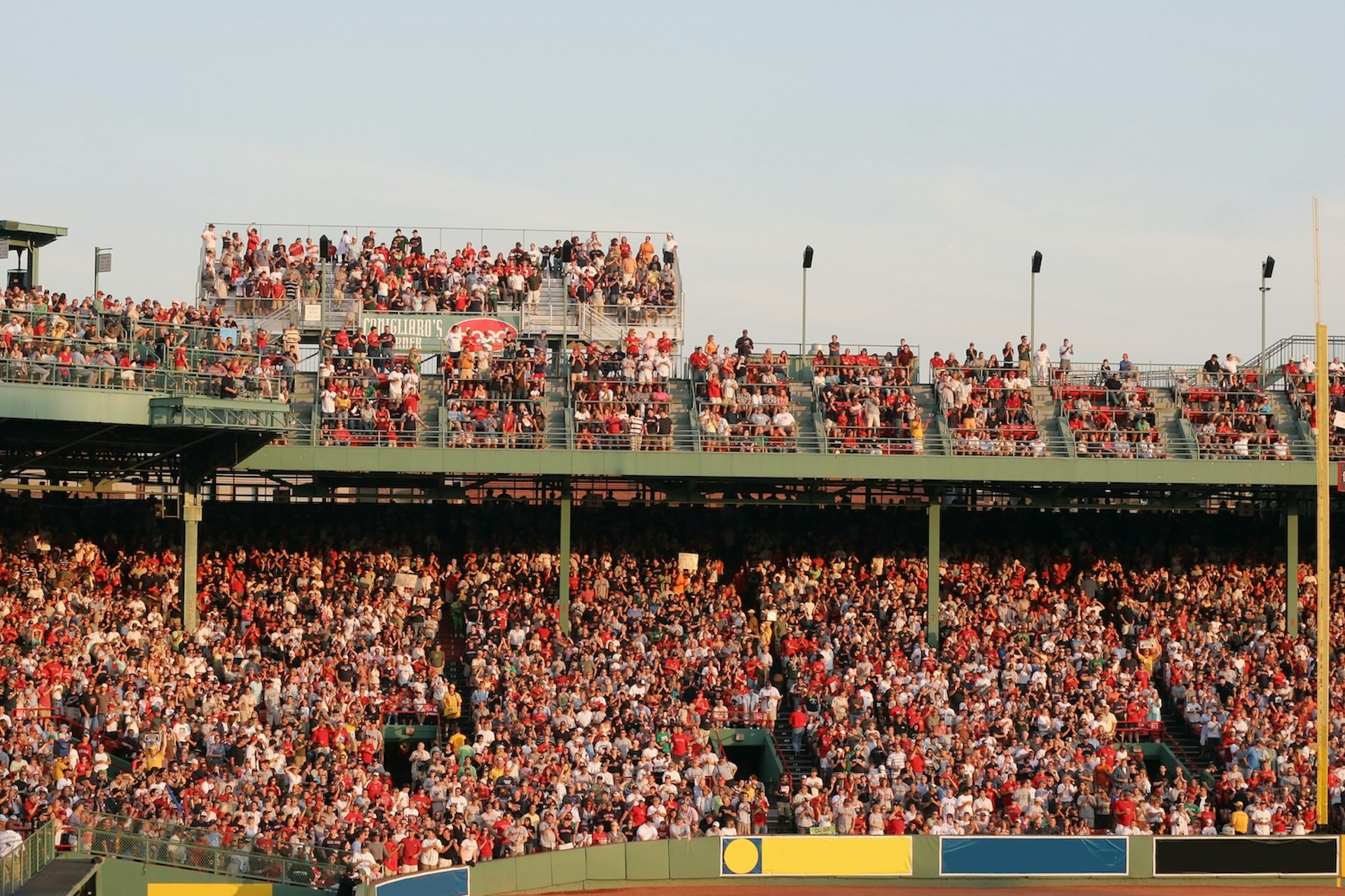 Attendees pack the bleachers at Fenway Park for a Red Sox baseball game, Boston, Massachusetts, USA