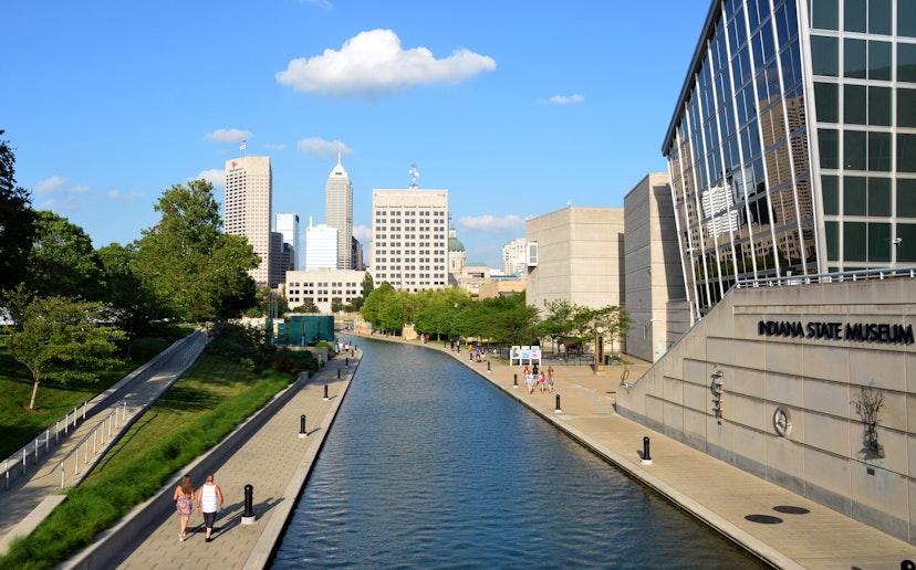 Indianapolis, IN, USA - June 17, 2014: Indianapolis skyline seen from Canal Walk near the Indiana State Museum June 17, 2014. The three mile loop is a popular walking and jogging trail in downtown Indianapolis.