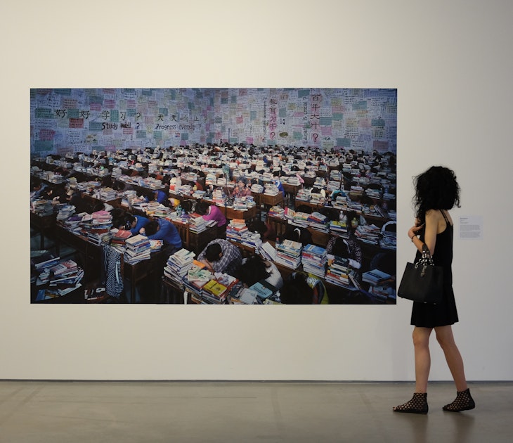 A visitor walks past a thought-provoking painting at art exhibition at the MOCAK Museum of Contemporary Art Krakow, Poland