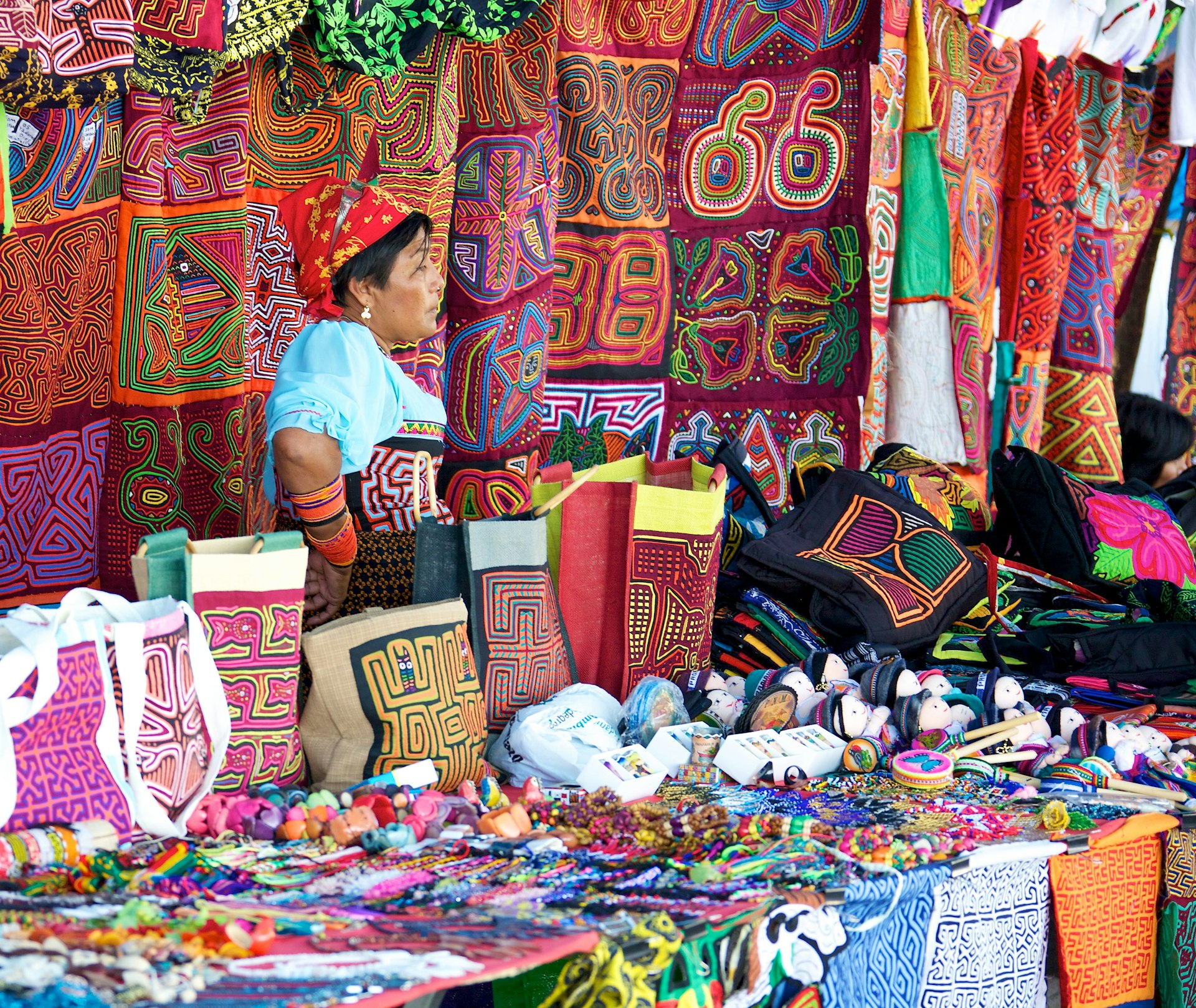 A Kuna, aka Guna, woman selling molas in an open air market in Panama City. 