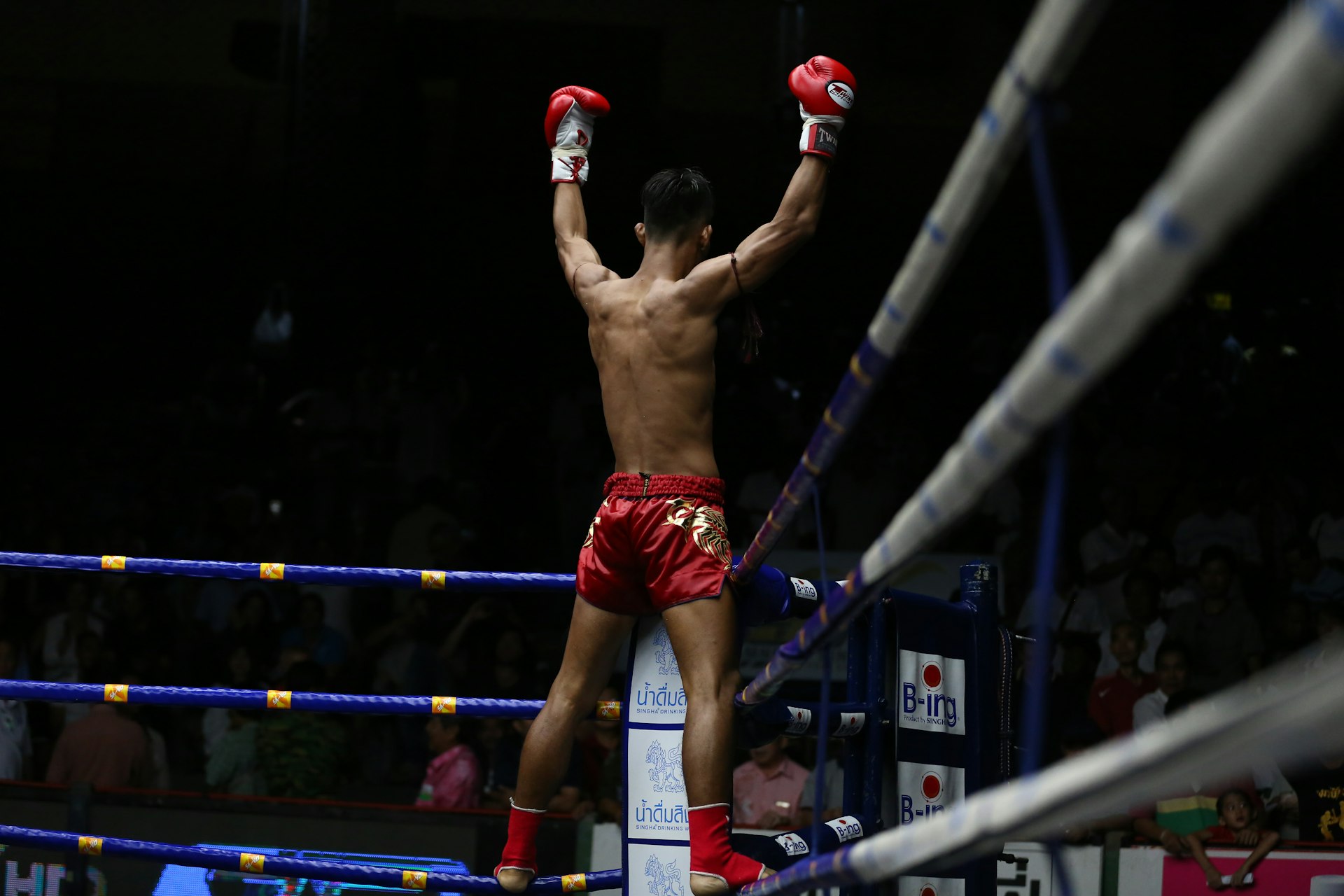 A fighter celebrates after a fight at Rajadamnern Stadium, Bangkok