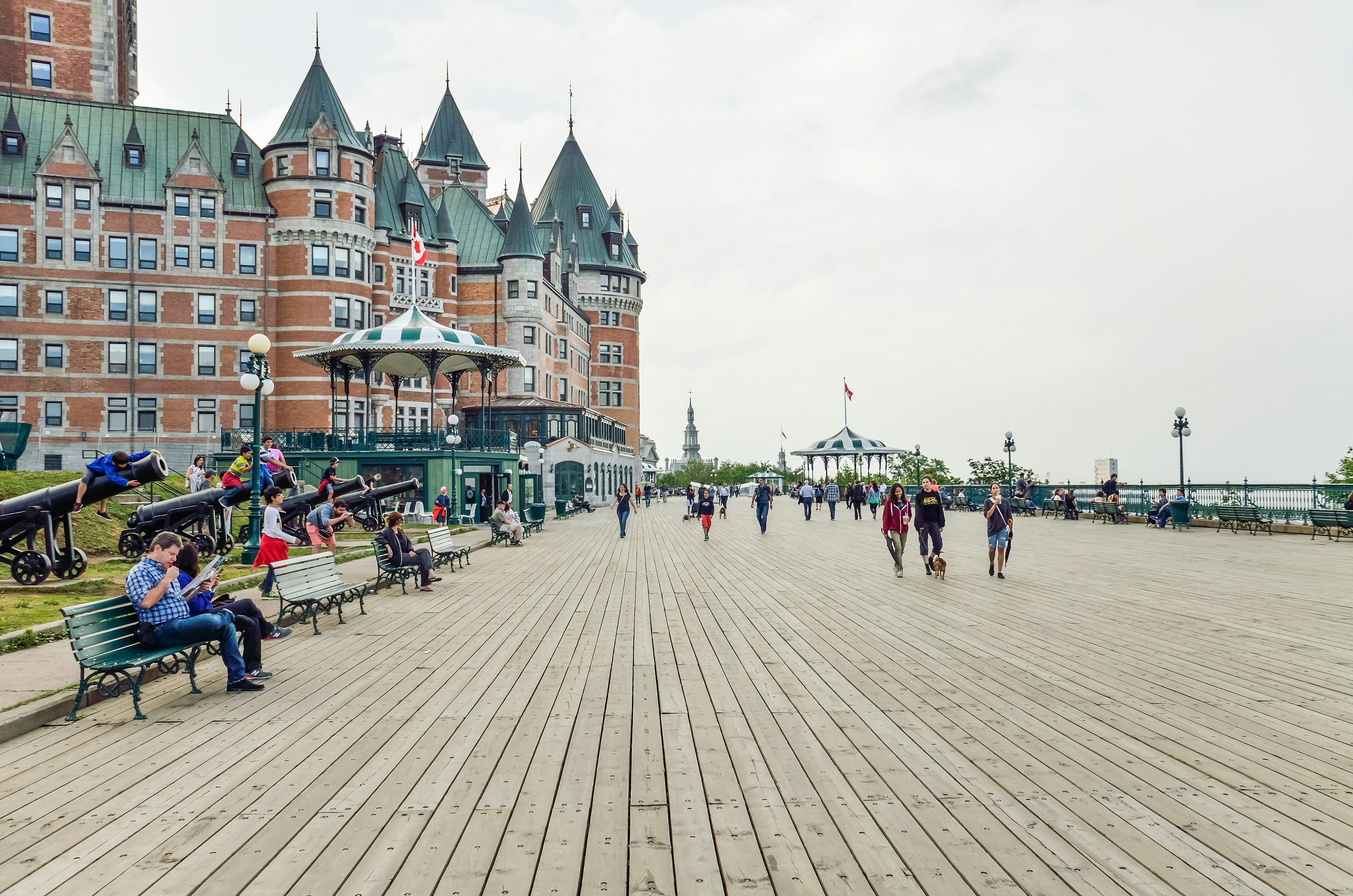 People walking on the boardwalk of Dufferin Terrace near Quebec City's Chateau Frontenac