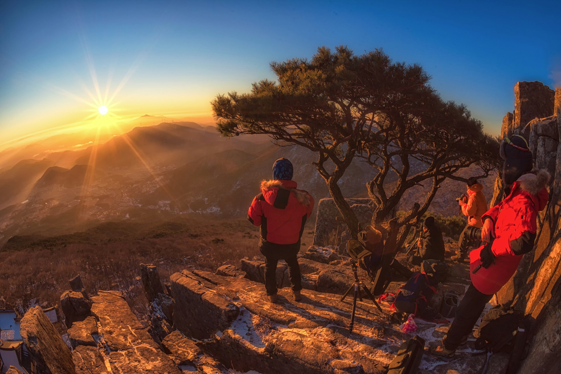 Hiker in Jeollanam-do province at sunrise overlooking the mountains in South Korea