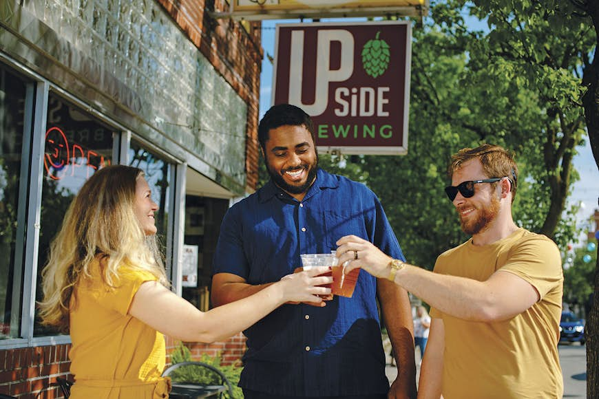 Friends drinking beer in downtown Toledo OH