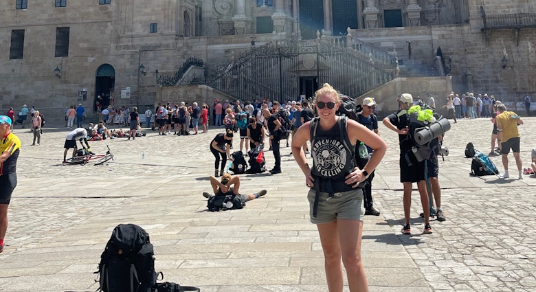 Lonely Planet senior news editor Melissa Yeager at the Cathedral in Santiago de Compostela after finishing the Portuguese Way of the pilgrimage. 