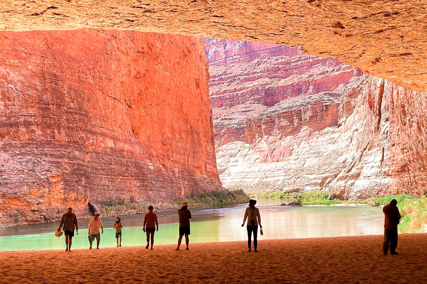 Rafters explore a huge cave on the banks of the Colorado River