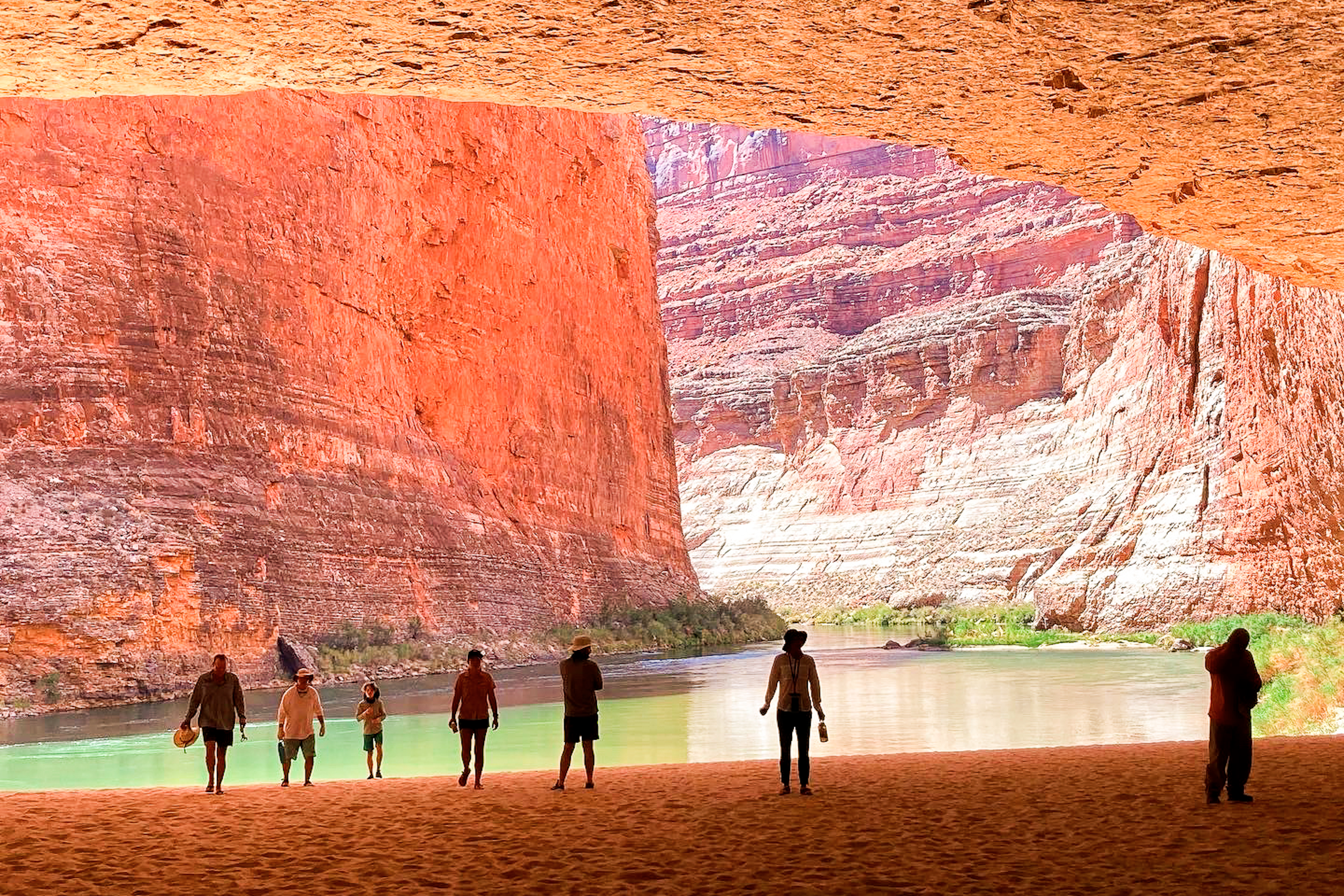 Rafters explore a huge cave on the banks of the Colorado River