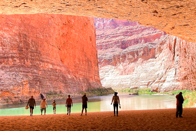 Rafters explore a huge cave on the banks of the Colorado River