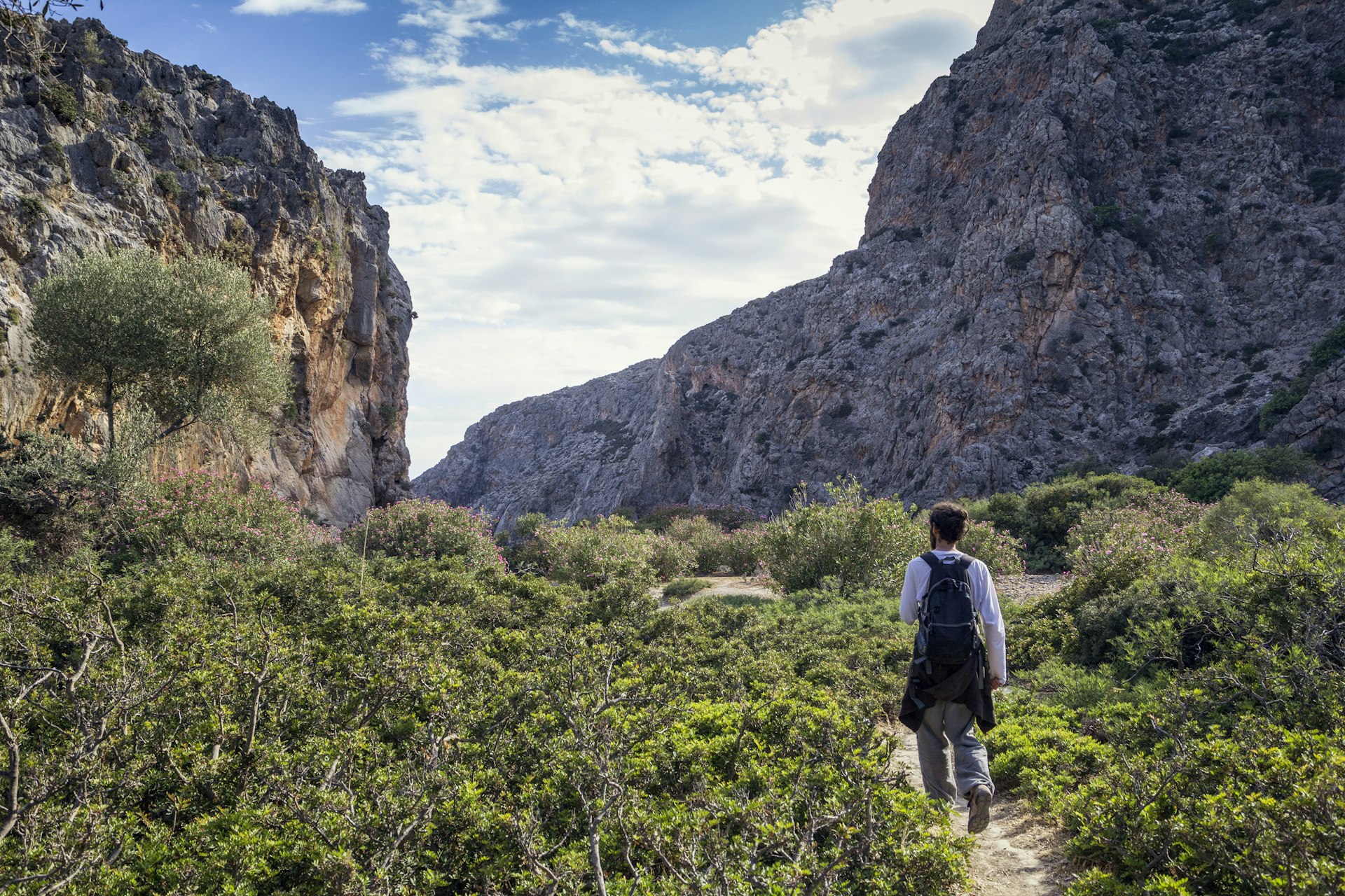 A man walking in a gorge in Crete