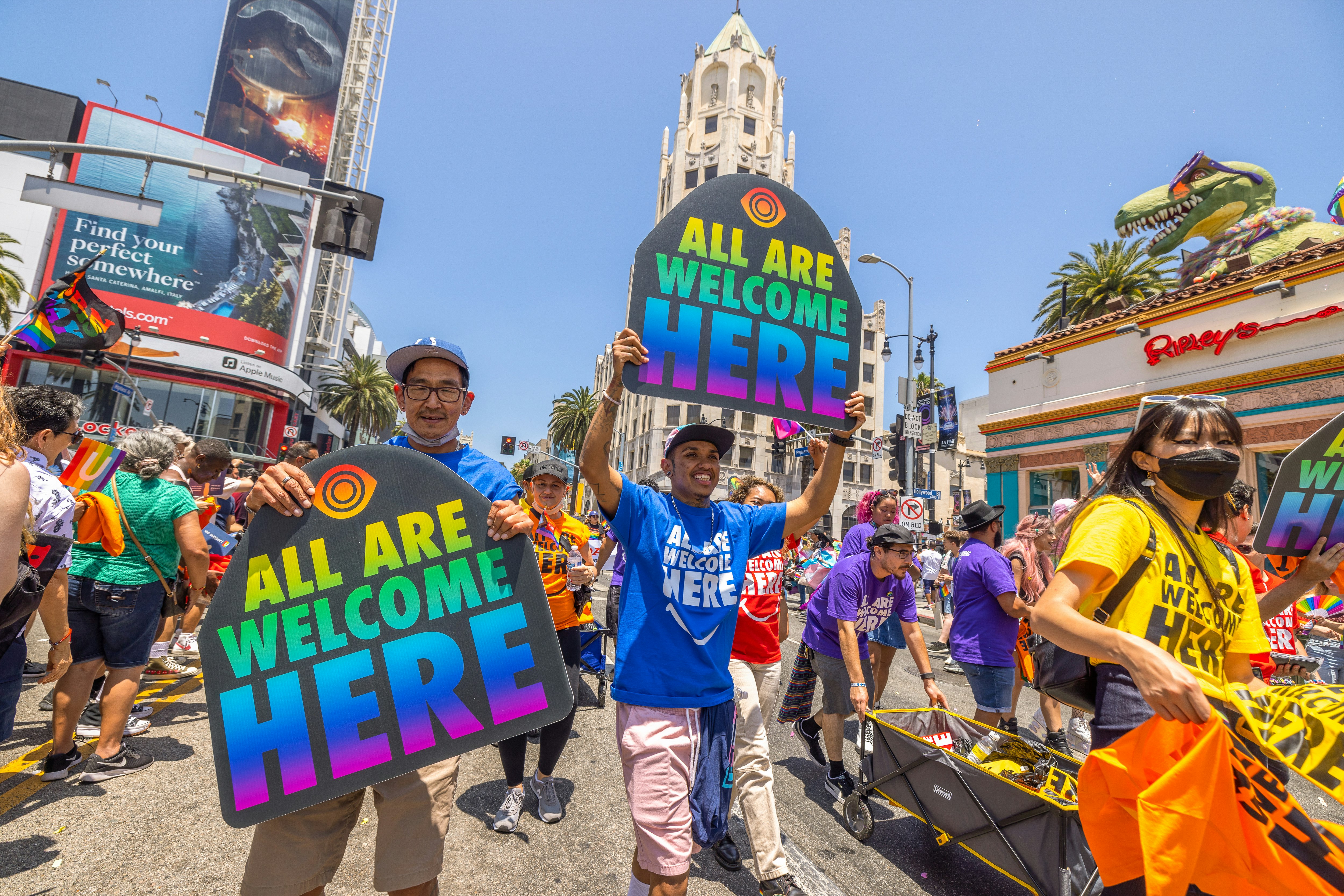 People march through the landmark intersection of Hollywood and Highland during the annual Pride Parade on June 12, 2022 in the Hollywood section of Los Angeles.