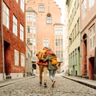 A couple walking down the street in Copenhagen