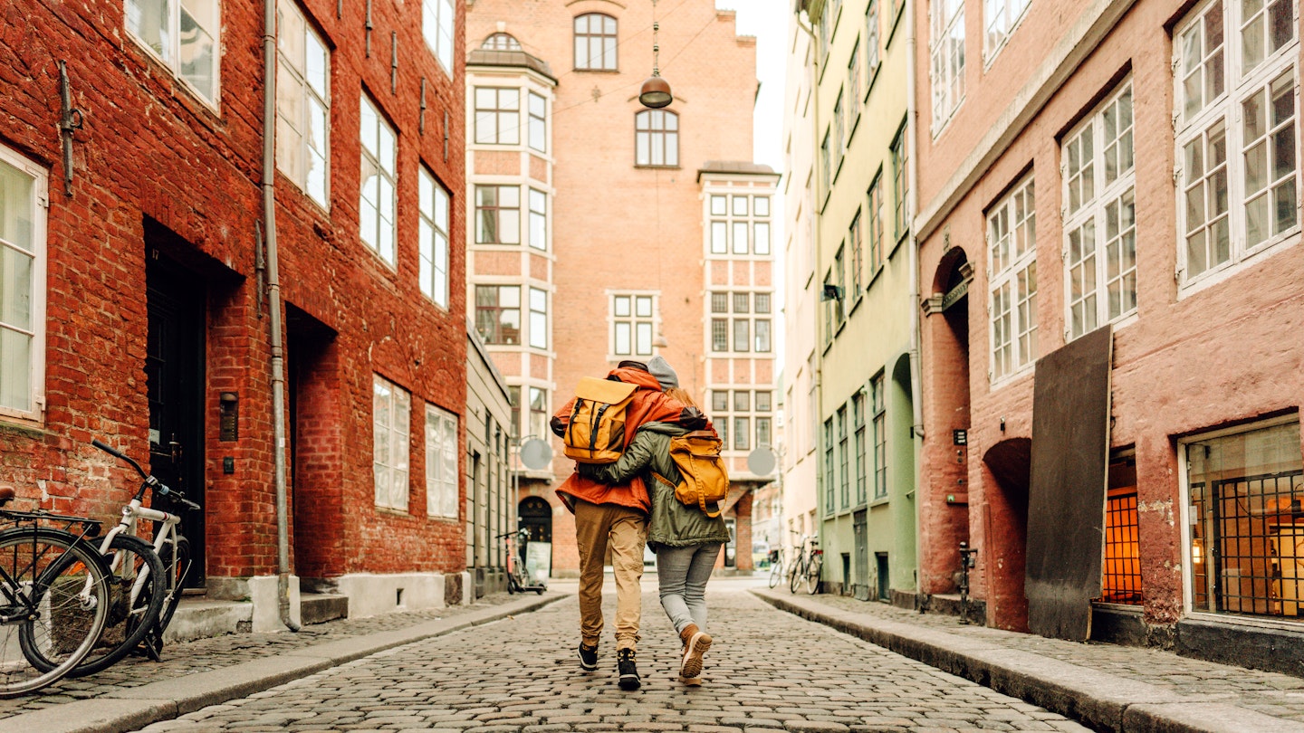 A couple walking down the street in Copenhagen