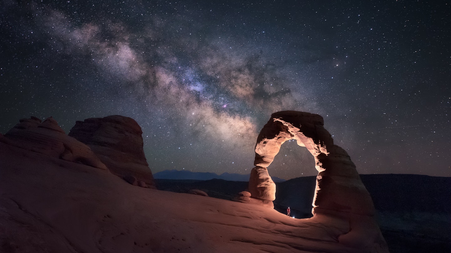 Standing under the Delicate Arch watching the Milky Way, Arches National Park, Moab, Arizona