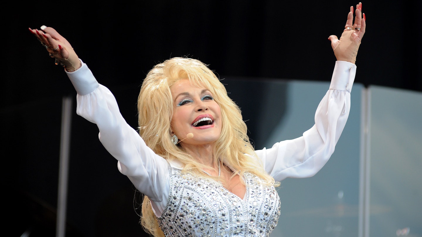GLASTONBURY, UNITED KINGDOM - JUNE 29: Dolly Parton performs on the Pyramid stage on Day 3 of the Glastonbury Festival at Worthy Farm on June 29, 2014 in Glastonbury, England. (Photo by Tabatha Fireman/Redferns via Getty Images)