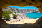 Matala beach through caves on the rocks that were used as a roman cemetery and at the decade of 70's were living hippies from all over the world, Crete, Greece