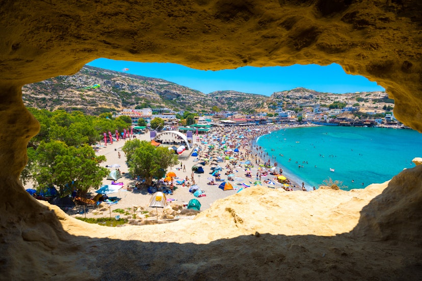 Matala beach through caves on the rocks that were used as a roman cemetery and at the decade of 70's were living hippies from all over the world, Crete, Greece