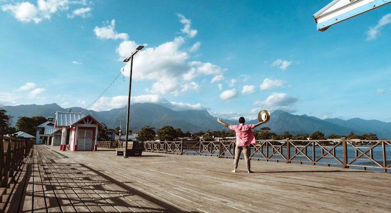 Tourist in a hat in the port of the city of La Ceiba, Honduras