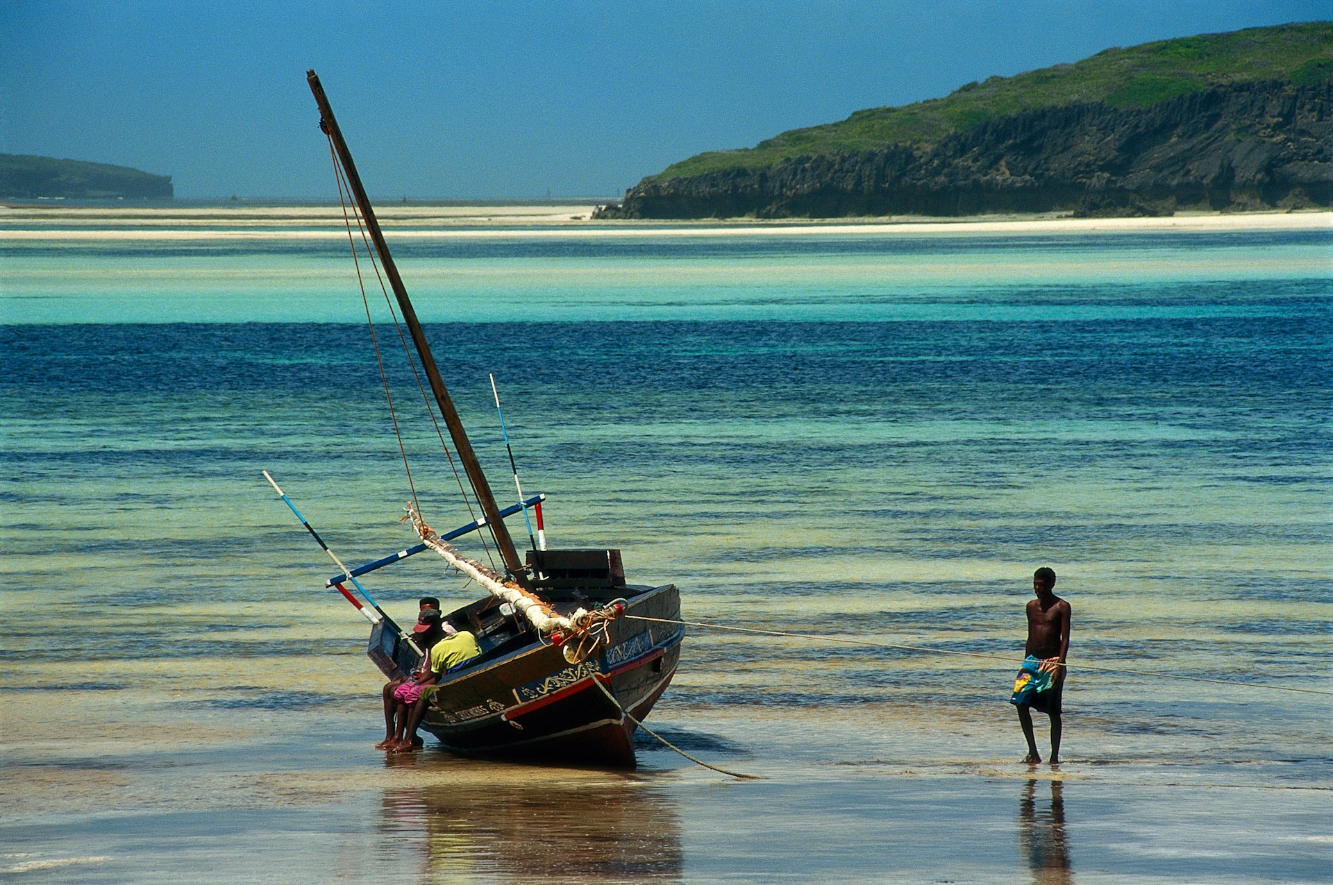 A boat at low tide on a beach in Watamu, Kenya