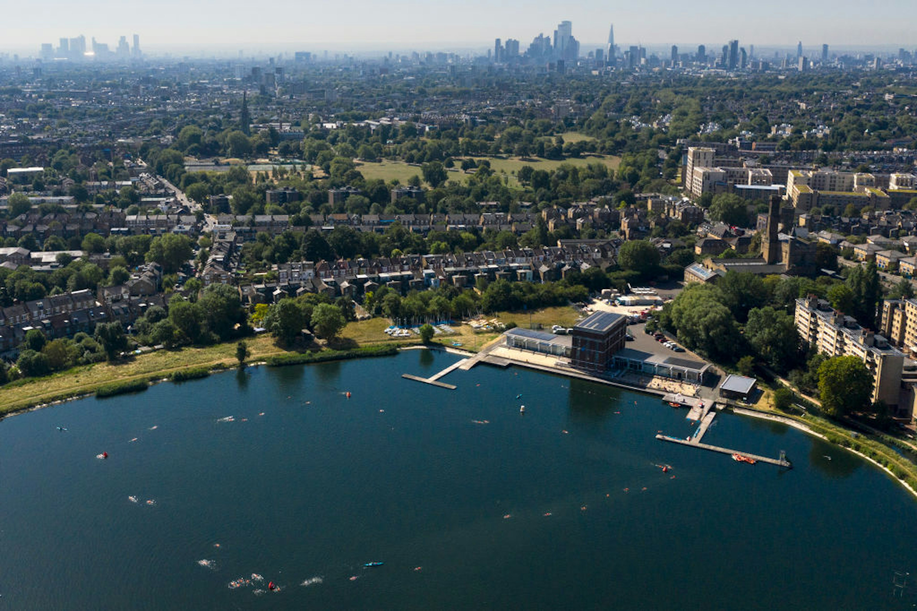 Members of the public enjoy an outdoor swim at West Reservoir in Stoke Newington