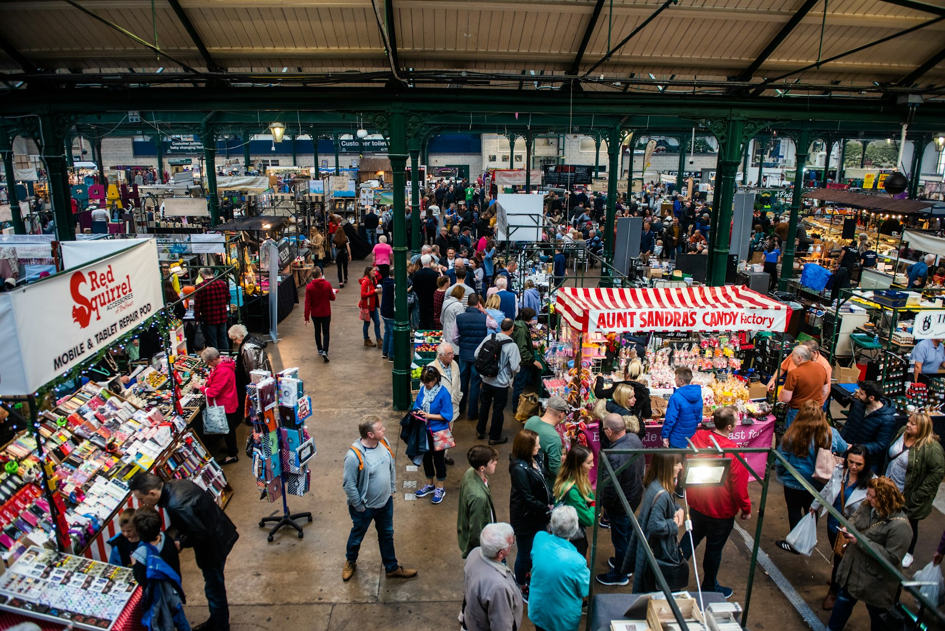 An overview of the many stalls selling wares under the Victorian facade of St George's Market in Belfast