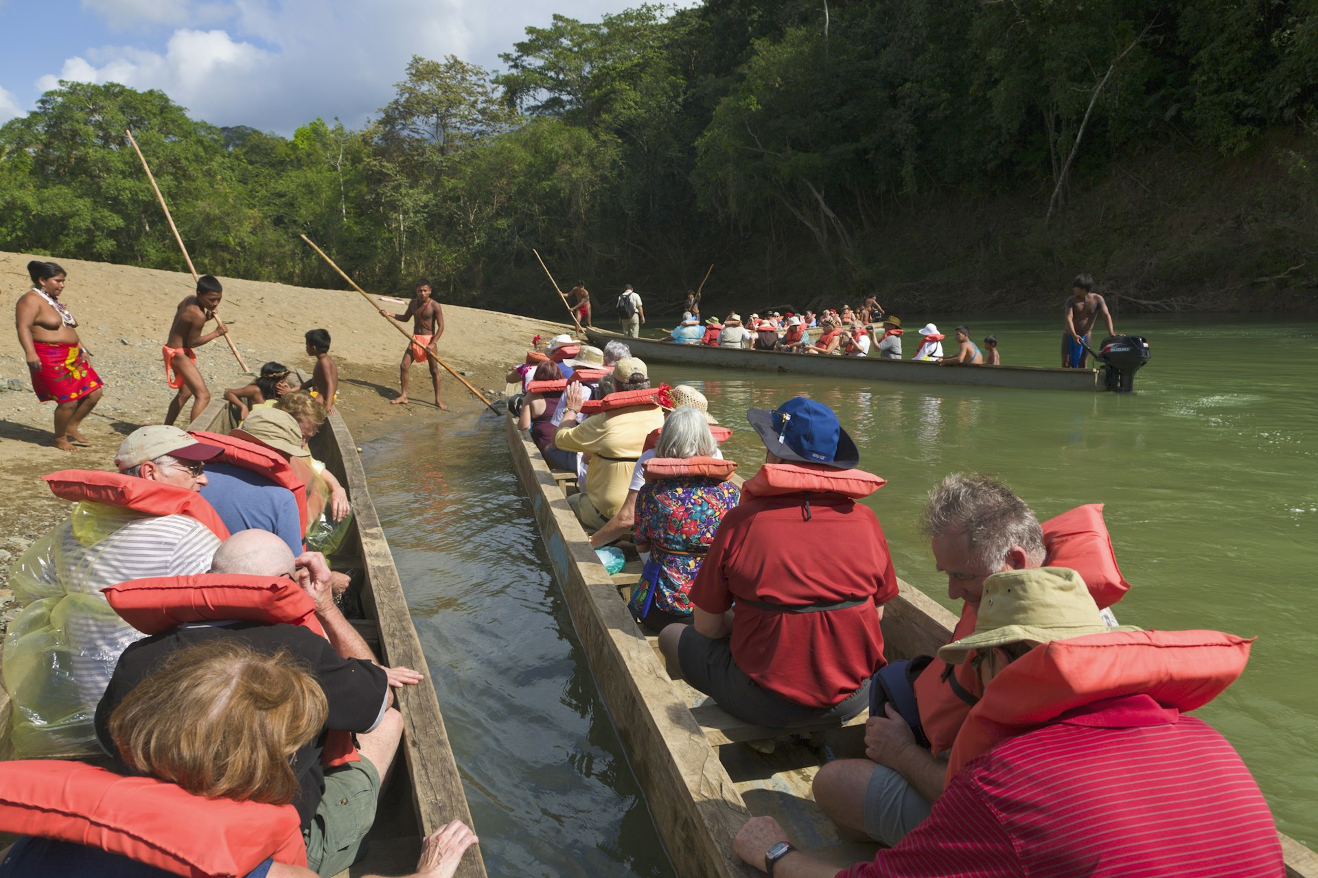 Tourists arrive at Embera village by piragua, Panama