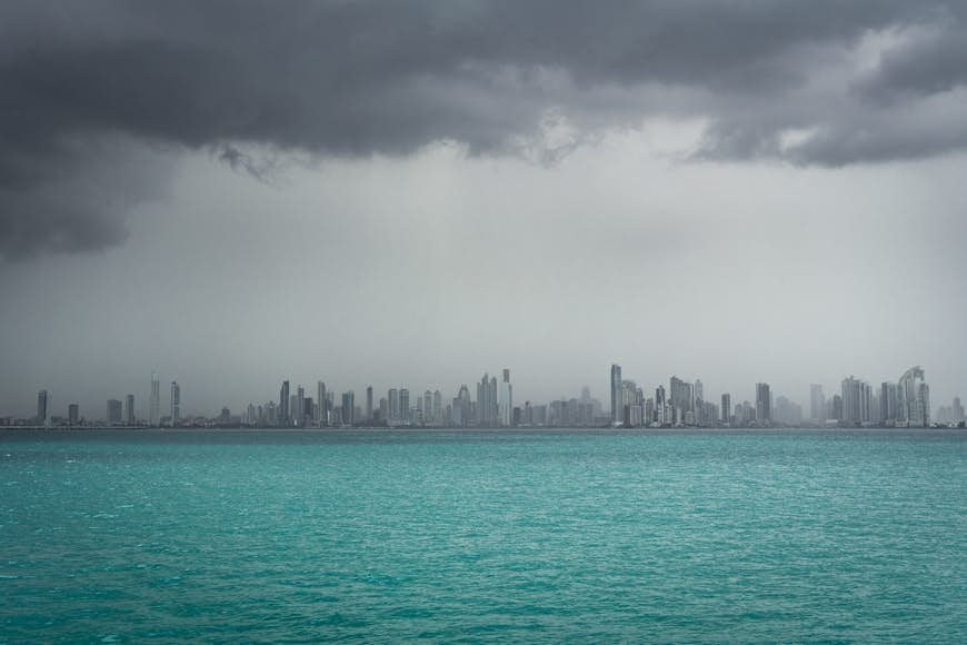 Rain over Panama City's skyline viewed from the water
