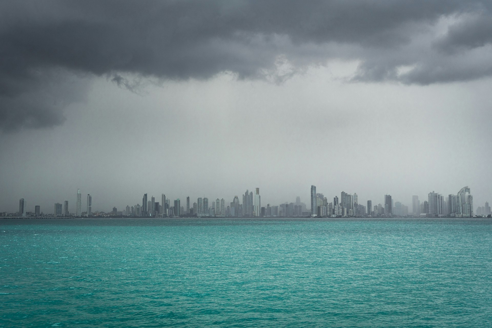 Rain over Panama City's skyline viewed from the water