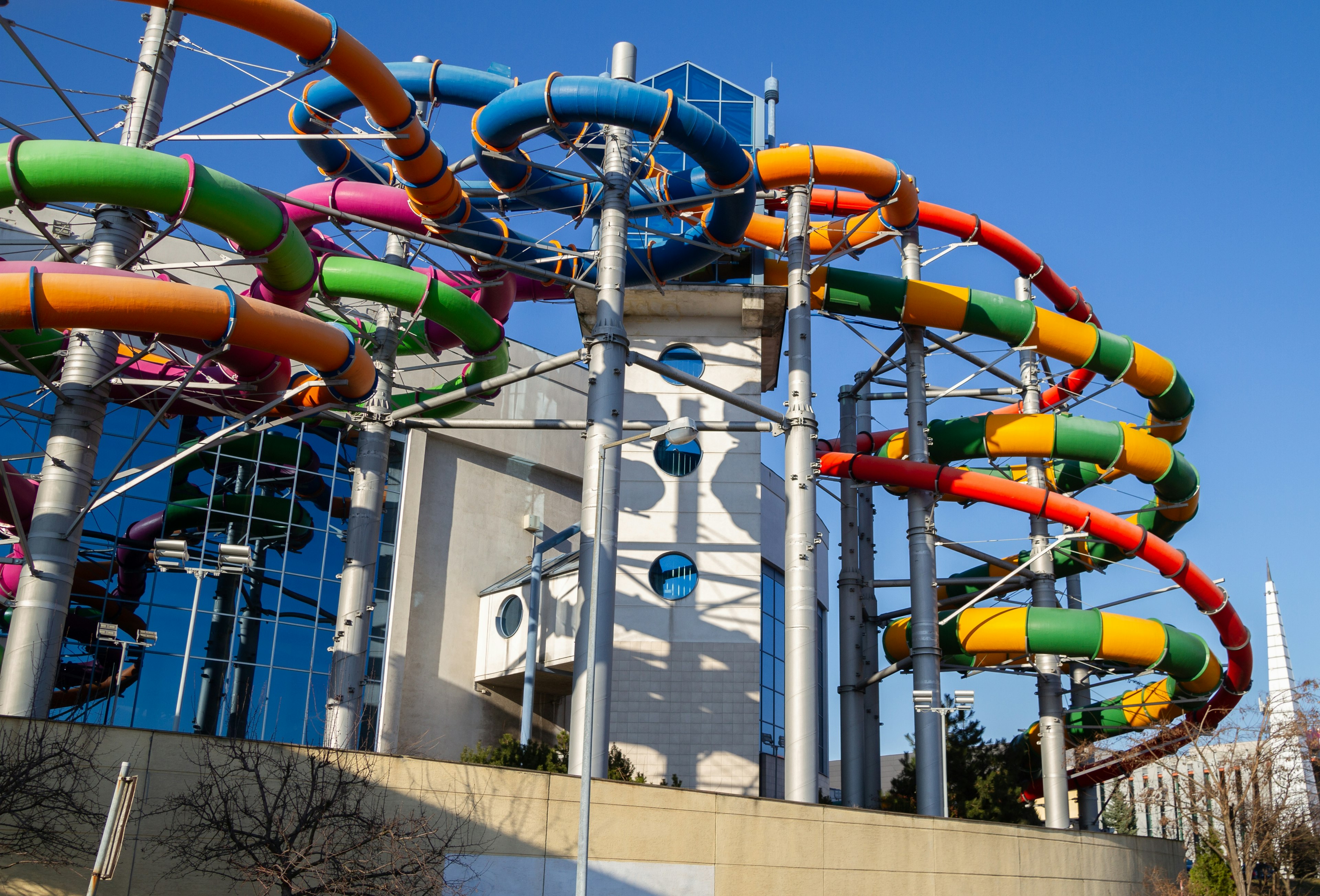 Several multi-colored water flumes snake their way around outside a leisure center in Krakow