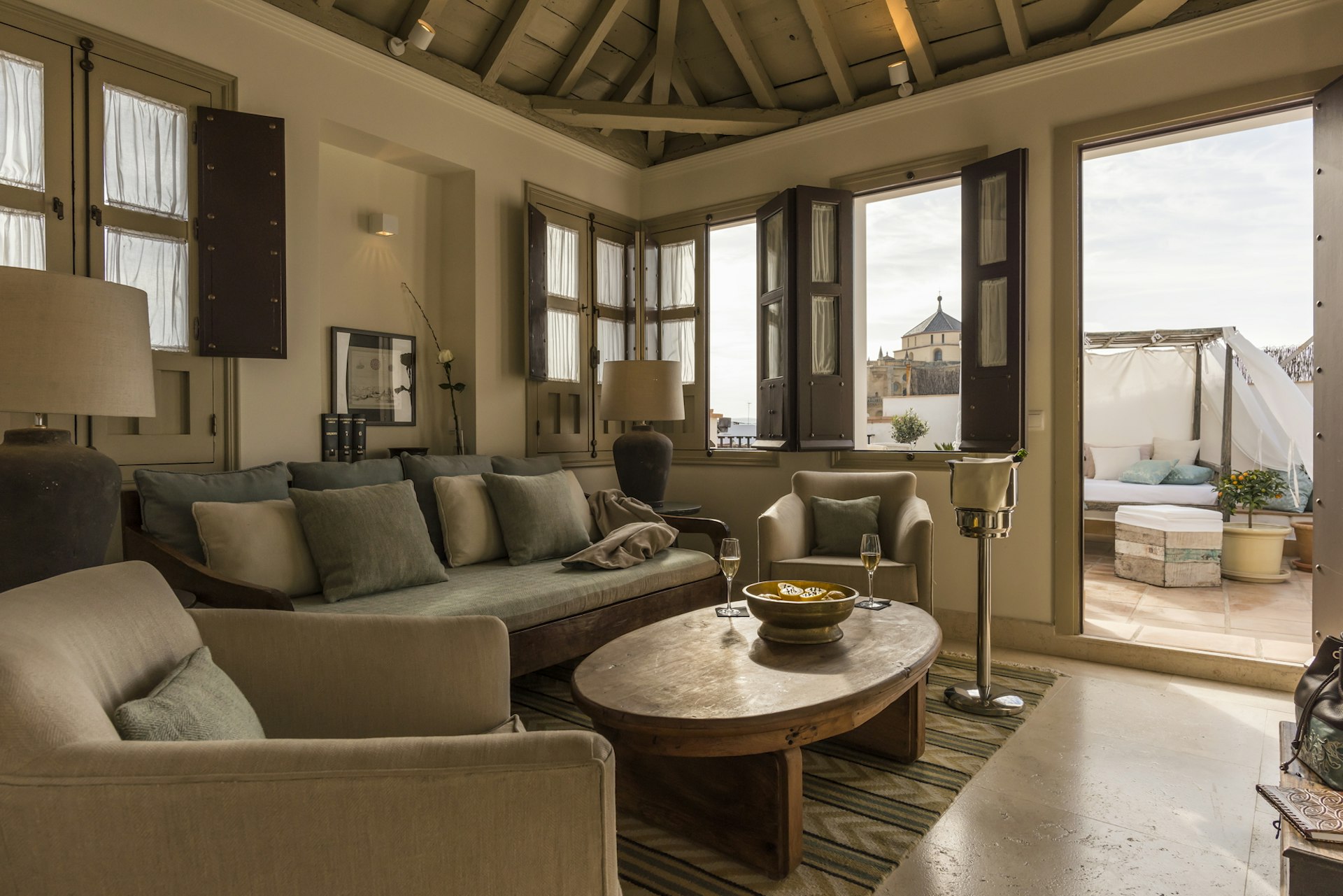 The luxurious living room leading onto the roof terrace in the Anahita suite at the Balcón de Córdoba hotel in Andalucia, Spain