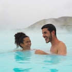 Couple swimming in Blue Lagoon, Iceland