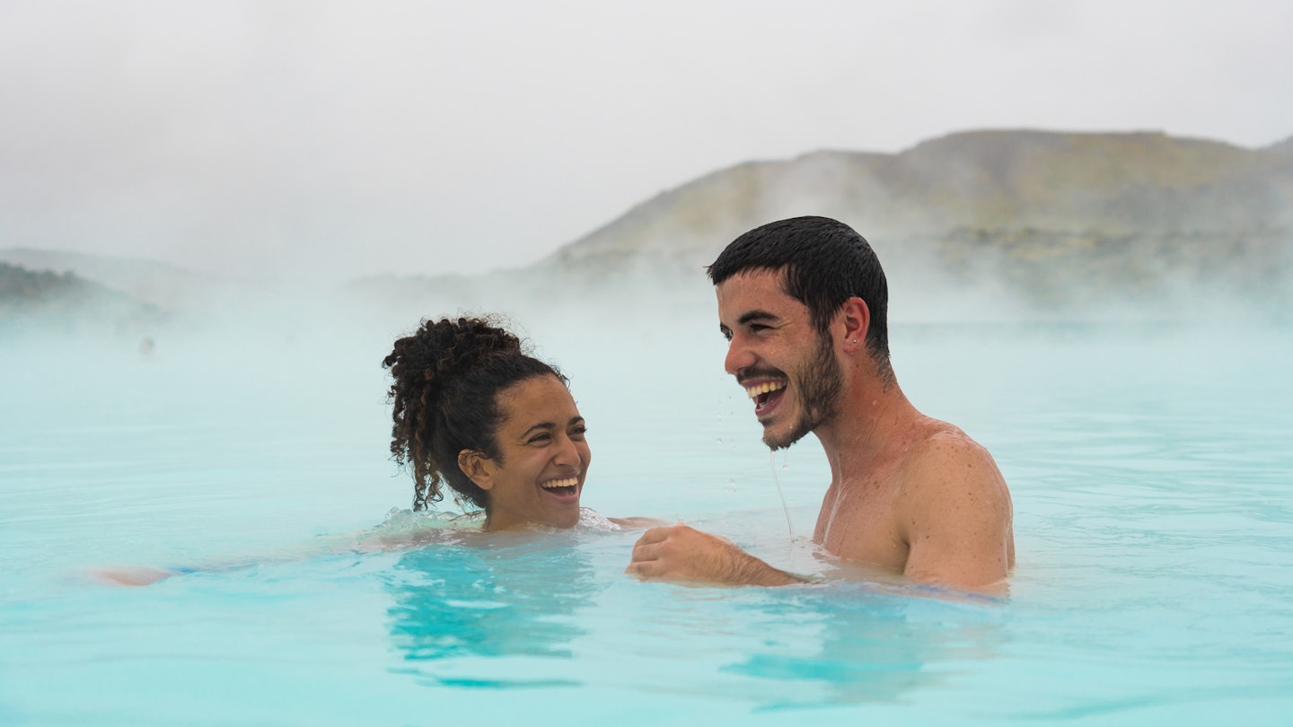 Couple swimming in Blue Lagoon, Iceland