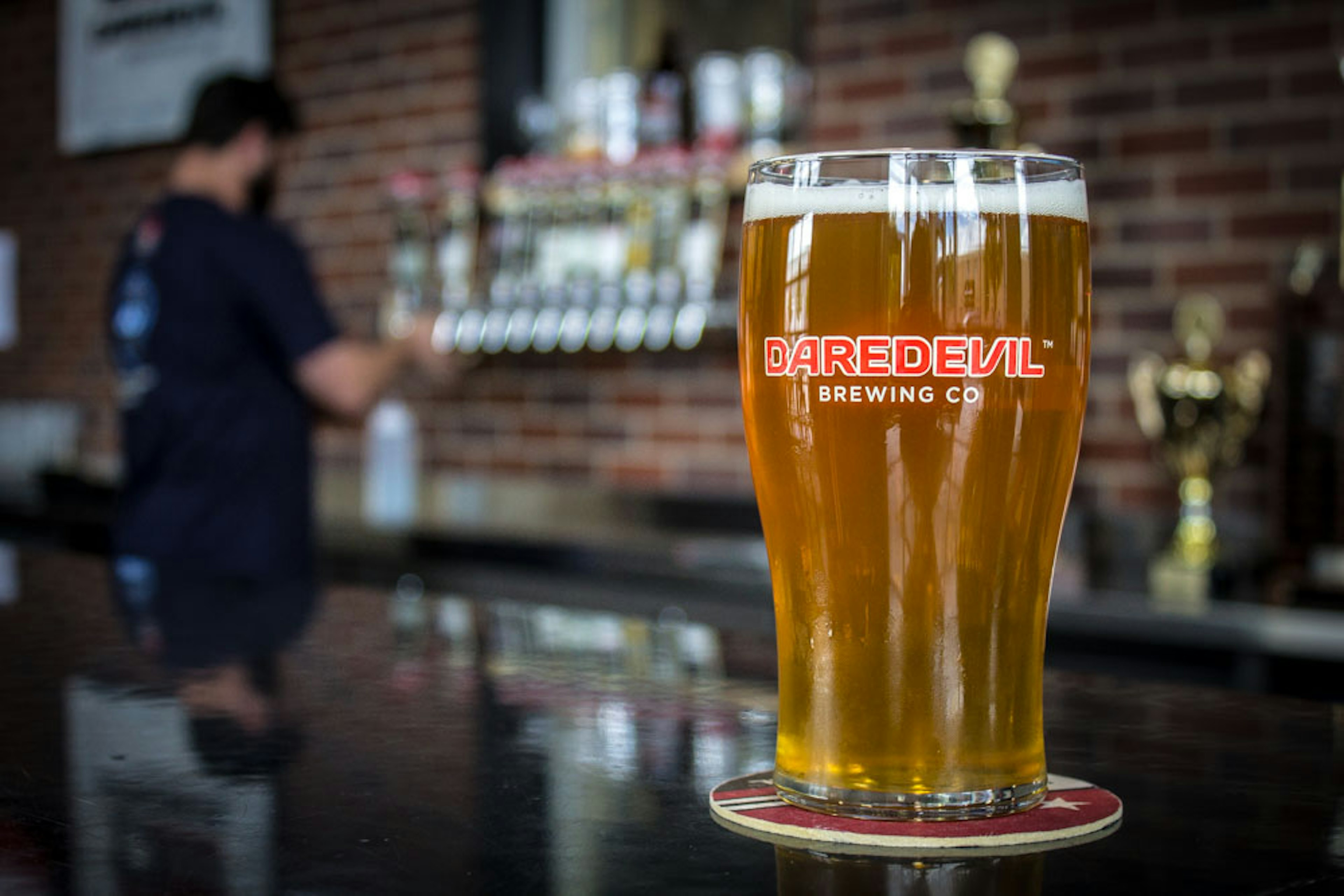 A pint of beer on the bar of Daredevil Brewery, Indianapolis, Indiana, Midwest, USA