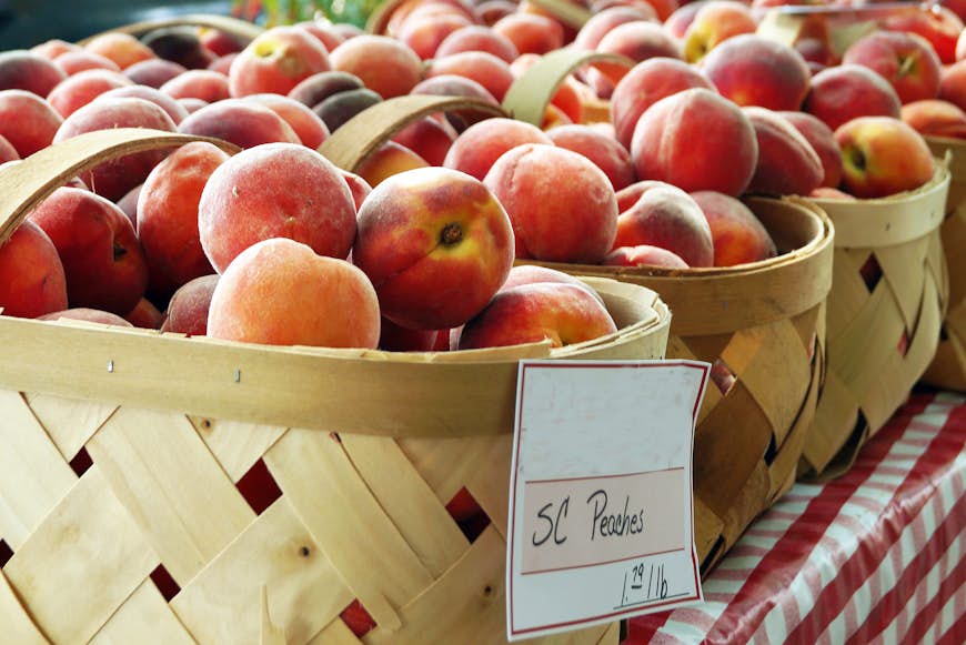 Baskets of peaches from South Carolina on sale at a local farmer's market