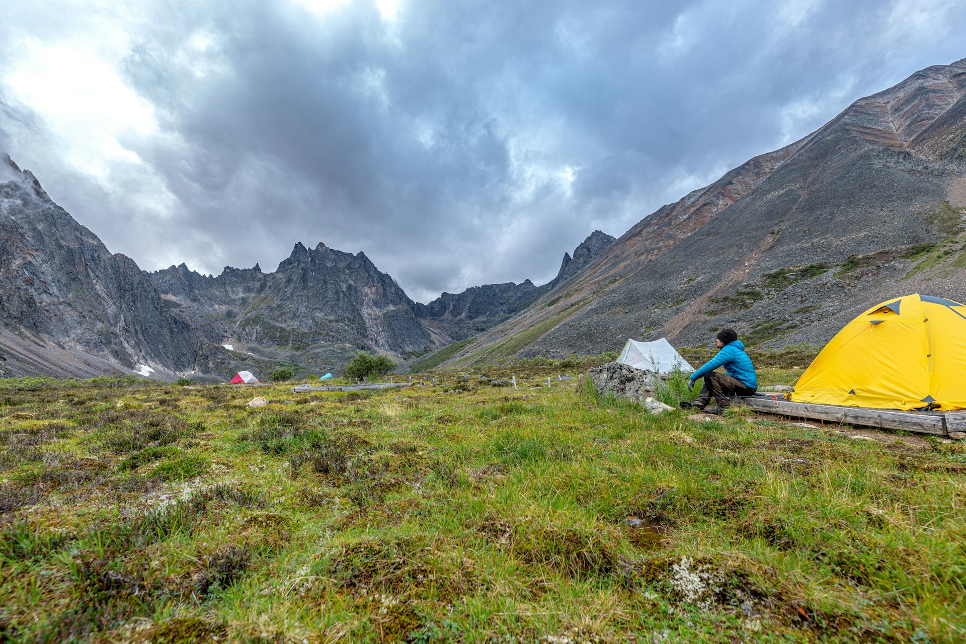 A hiker pauses at a campground near Grizzly Lake, Canada