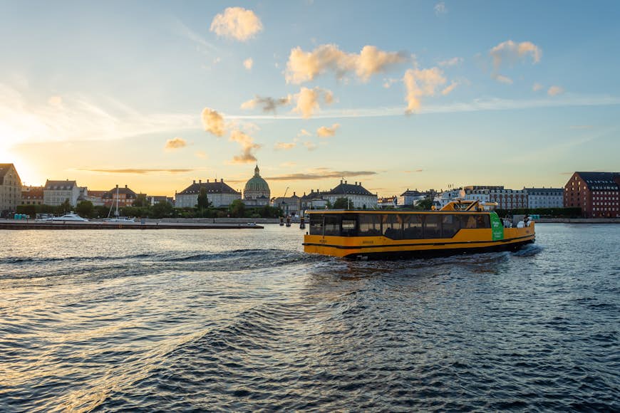 Copenhagen Harbor Bus on the water in Copenhagen at dusk