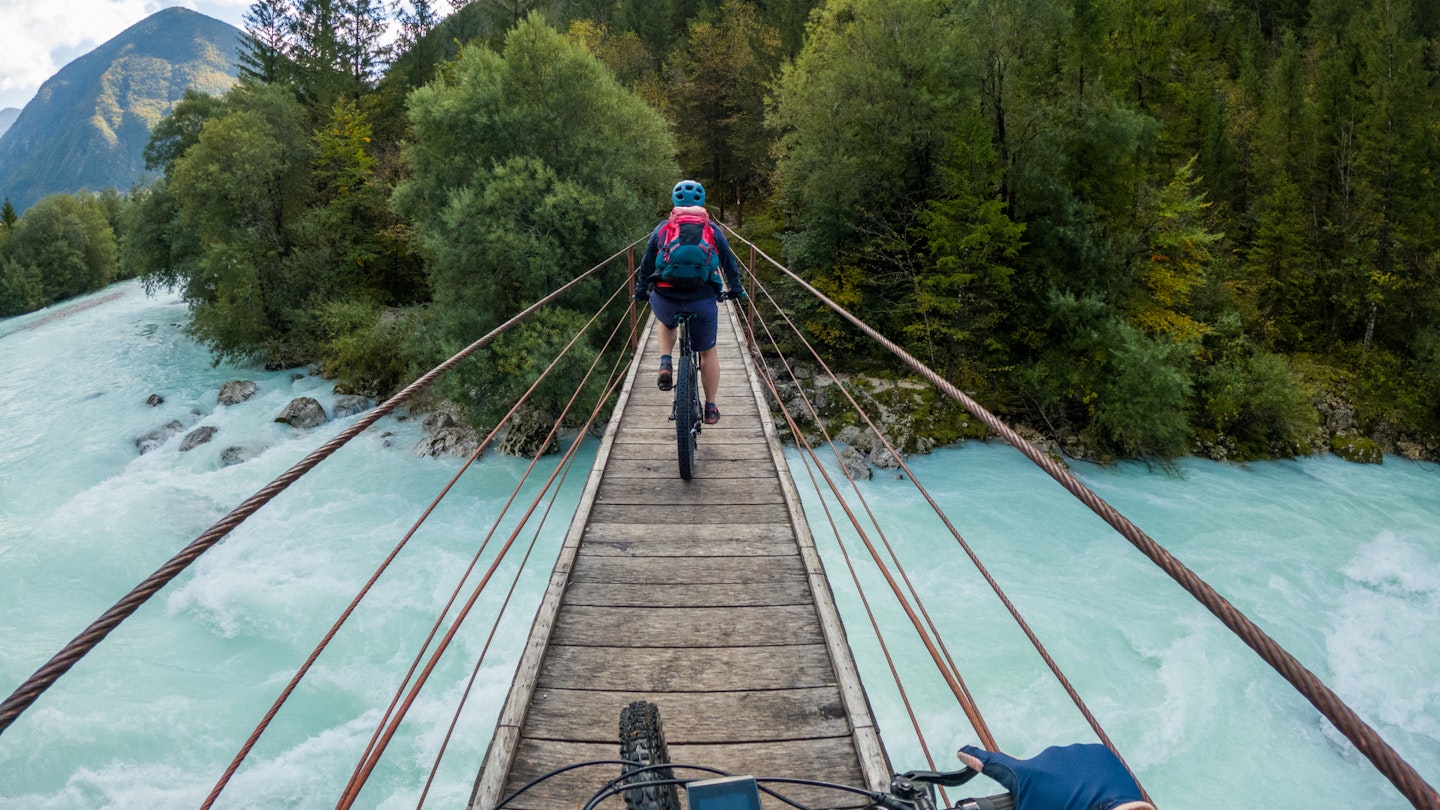Gopro First Person View Mountain Biking On Wooden Suspension Bridge Above Soca River, Slovenia. - stock photo
Photo taken in Kobarid, Slovenia