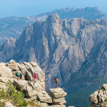 Trekking on the GR20 trail in Corsica near the Aiguilles de Bavella hiking towards Refuge d'Asinao