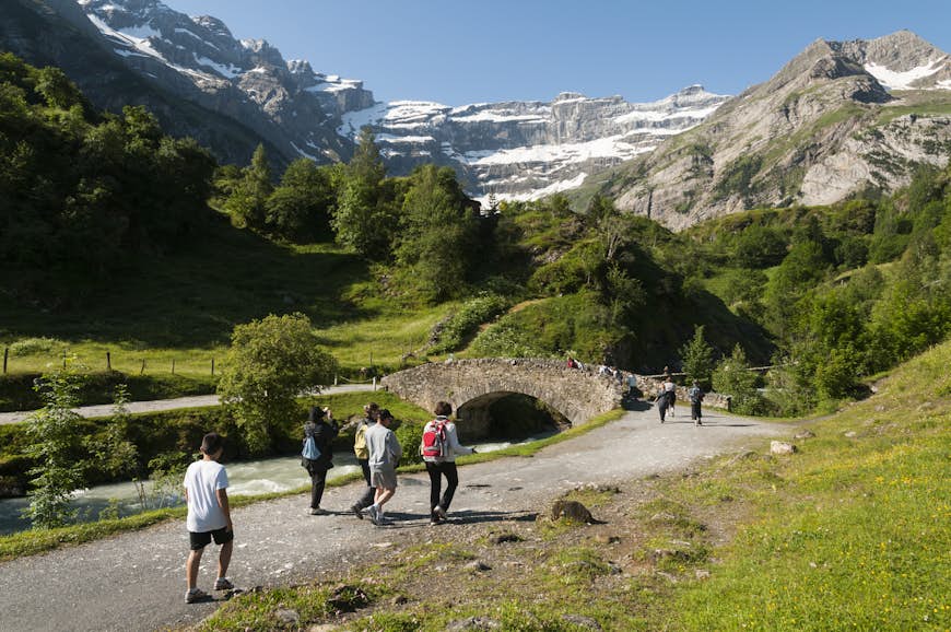 Hikers on a trail at the Cirque de Gavarnie in the French Pyrenees