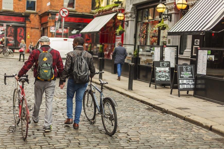 Gay men with bicycles in the Temple Bar district of Dublin, Ireland