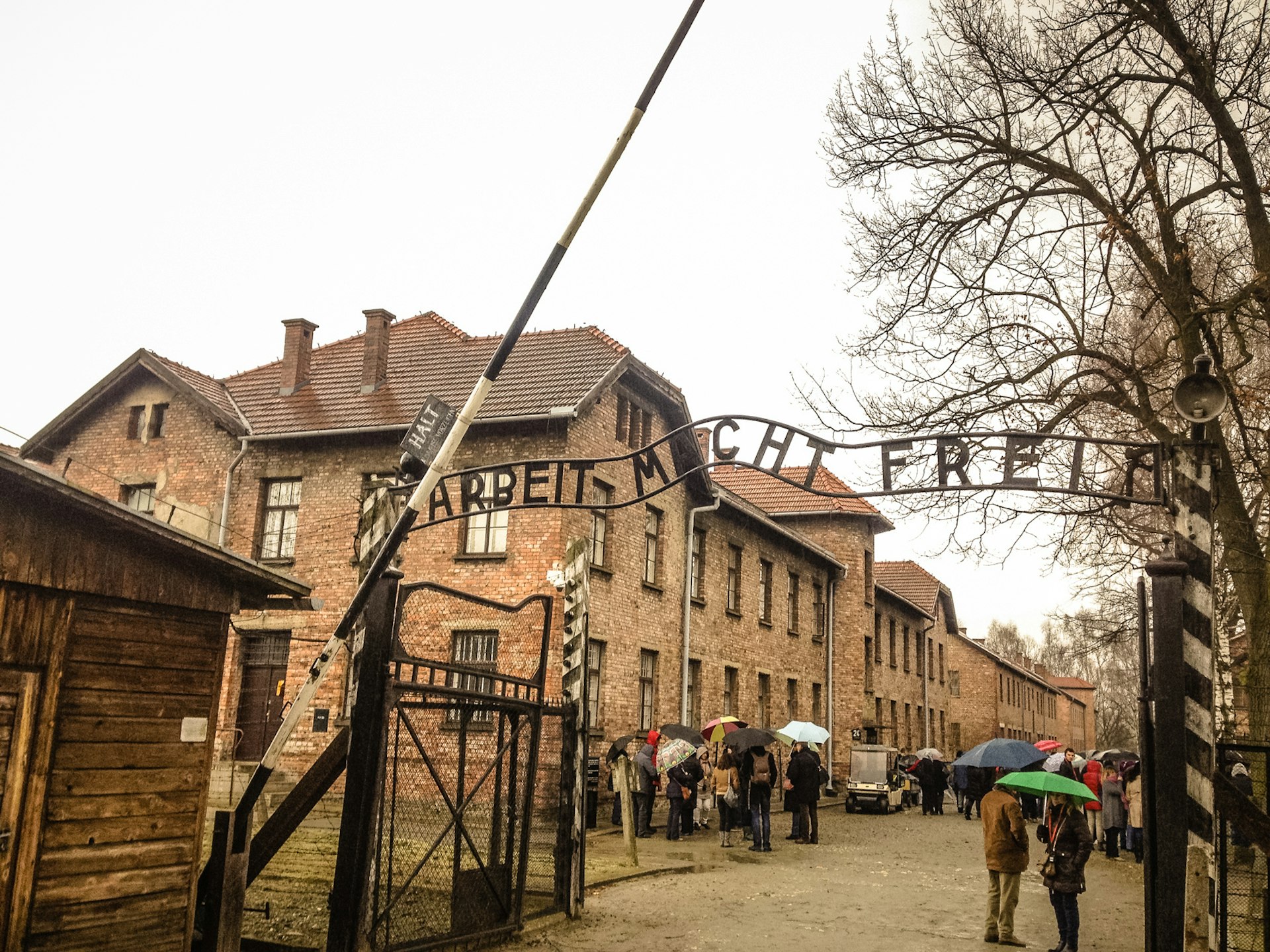  The entrance of the notorious Auschwitz, a former Nazi extermination camp and now a museum. Above the gate are the words arbeit macht frei ('Work sets you free')