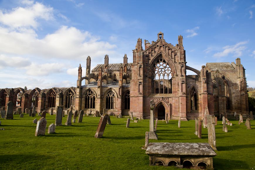 The ruins of Melrose Abbey on a bright sunny day, Melrose, Scotland, United Kingdom
